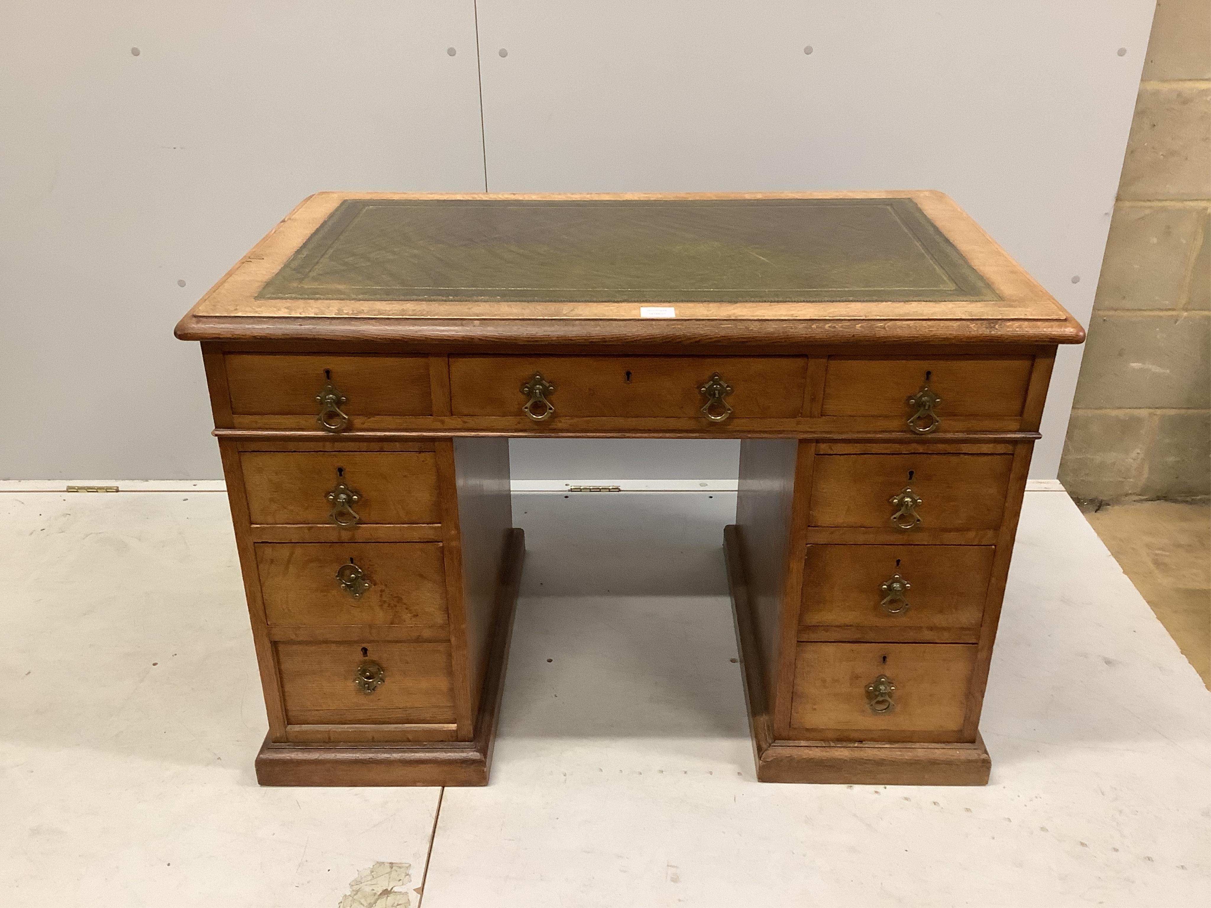 A late Victorian oak pedestal desk, width 106cm, depth 65cm, height 71cm. Condition - fair